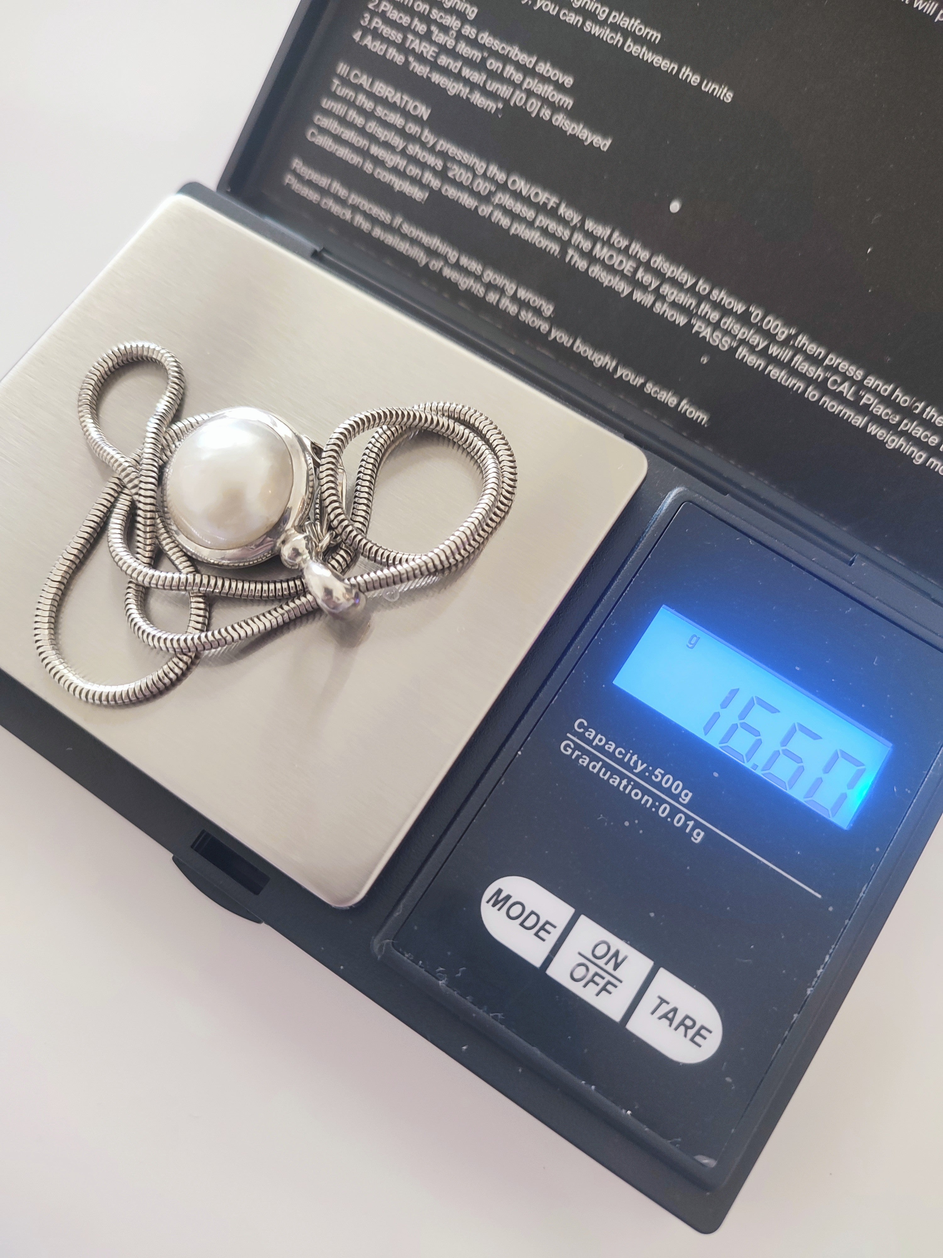 Silver necklace with large natural pearl