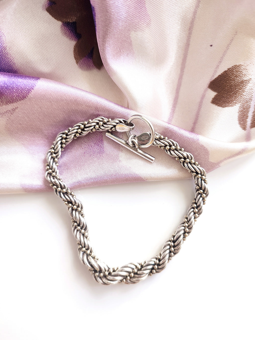 Silver twisted rope bracelet with open clasp