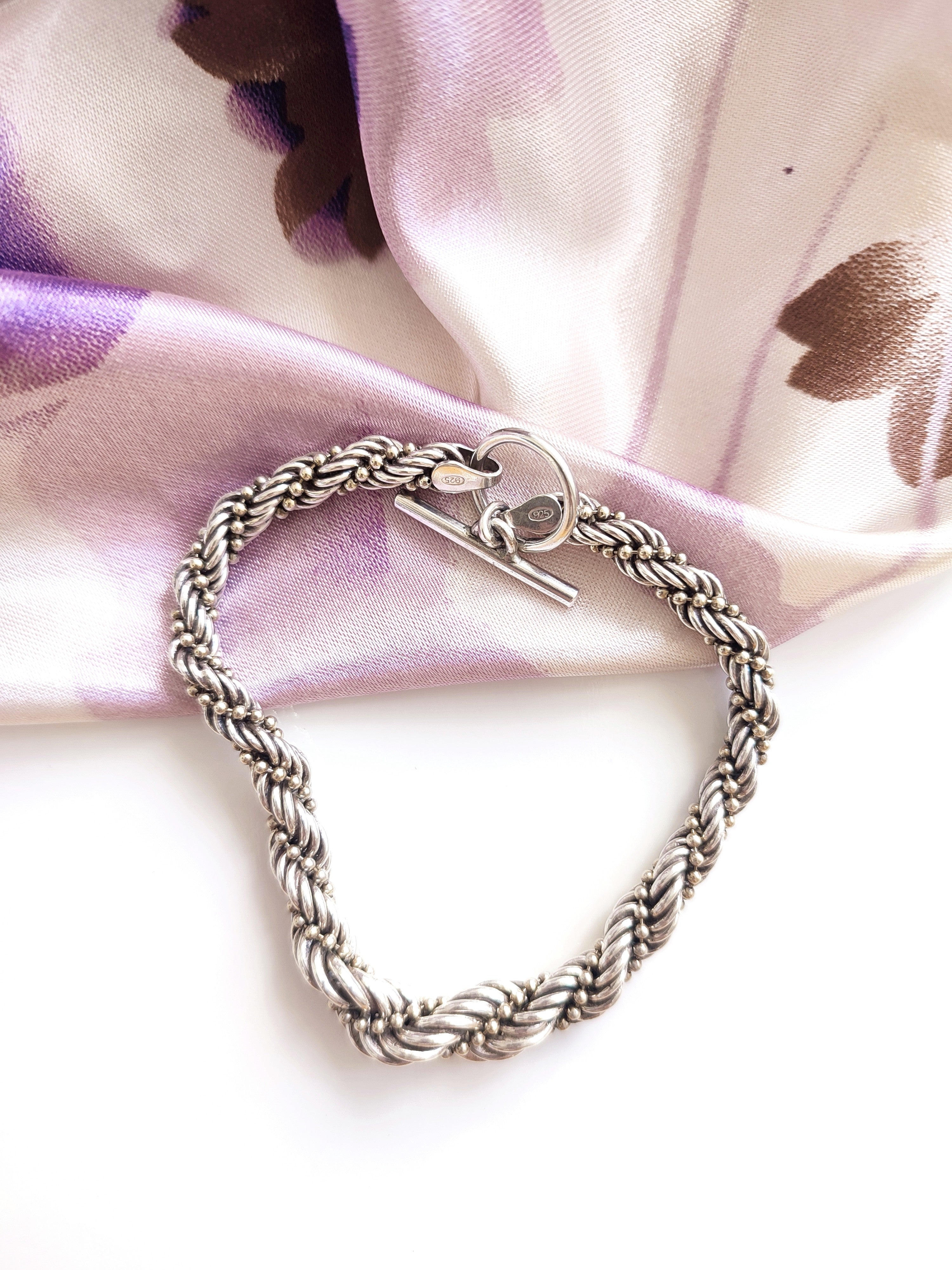 Silver twisted rope bracelet with open clasp