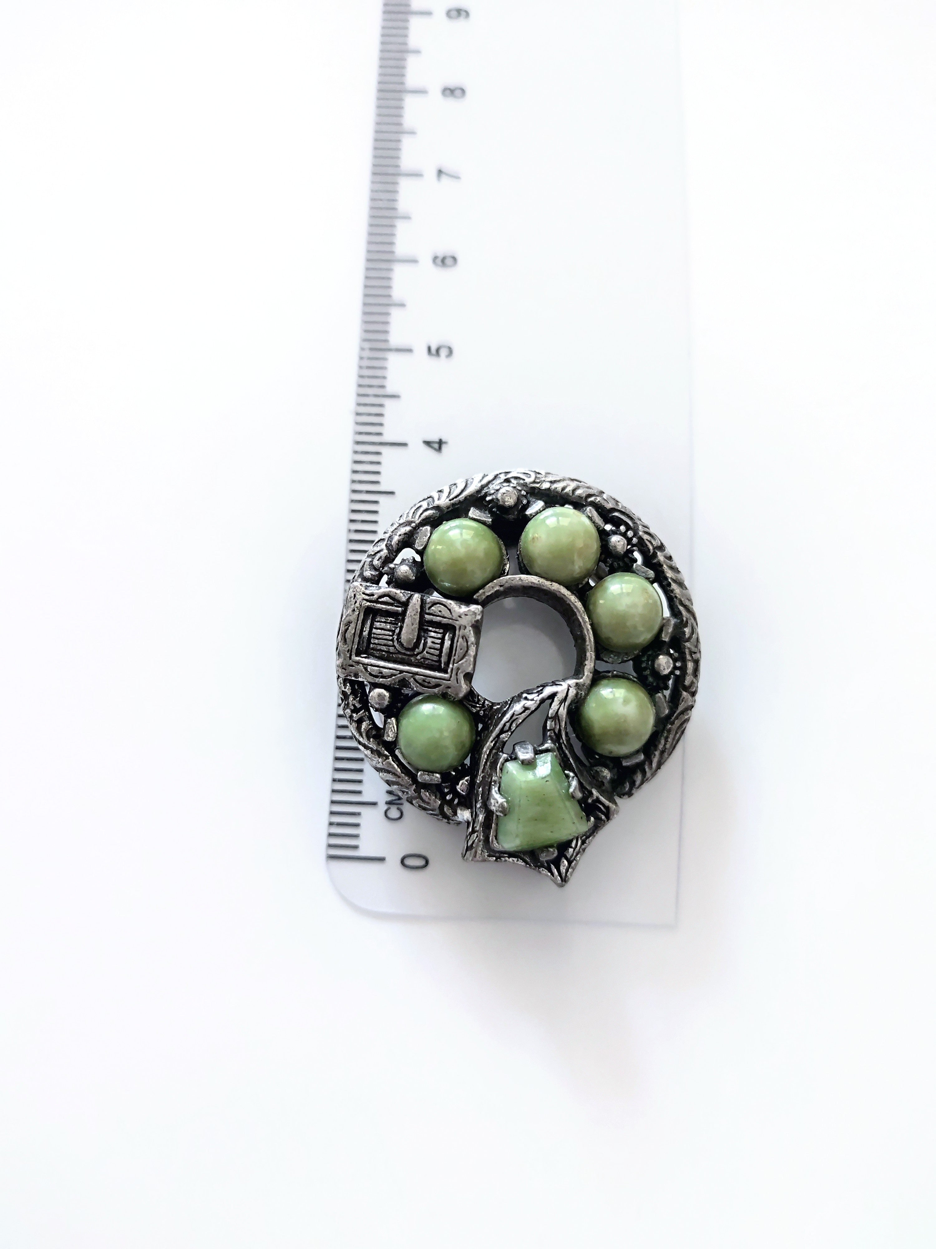 Miracle vintage Celtic clip with green glas stones