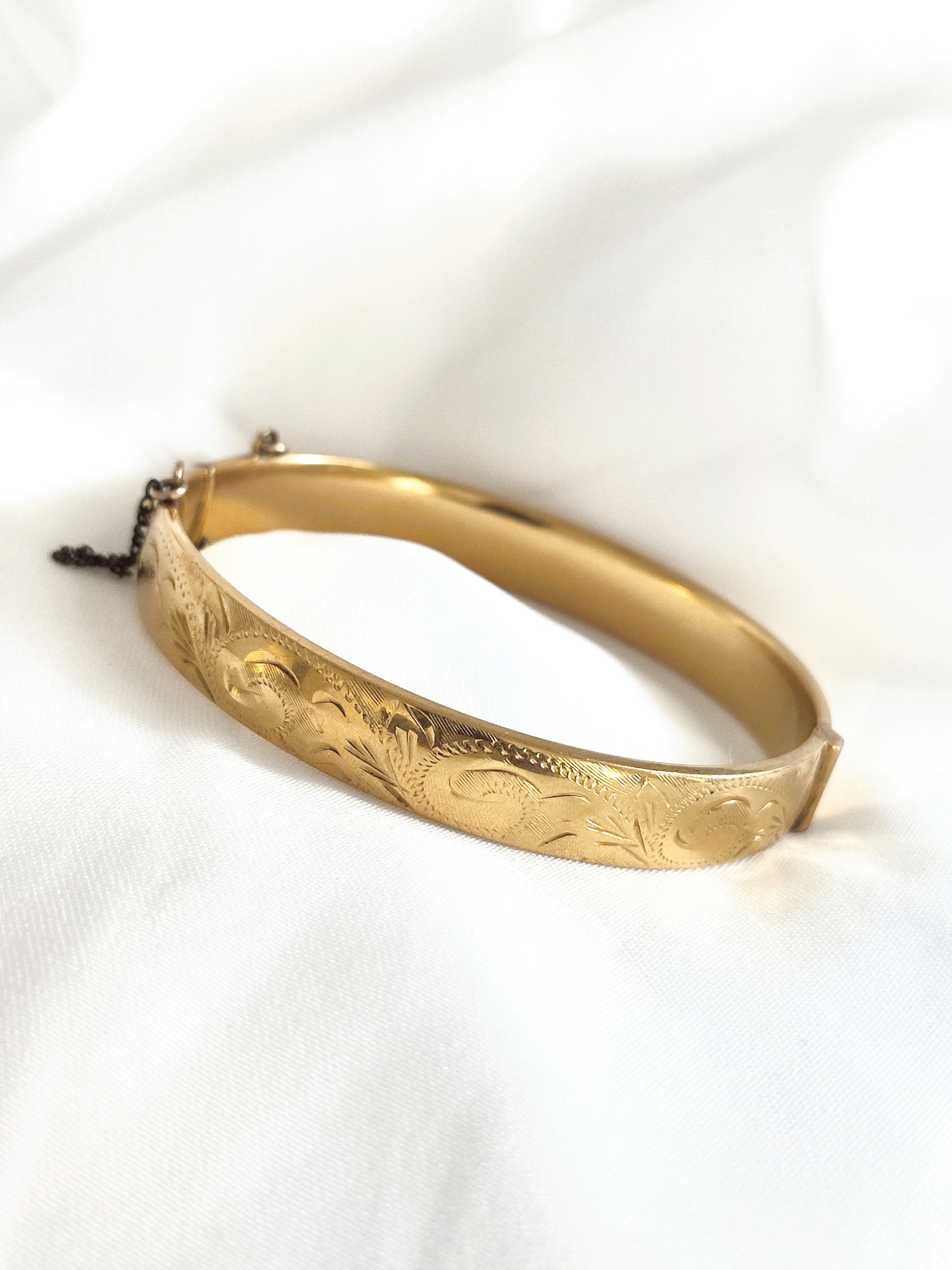 Gold rolled bangle with etched floral design