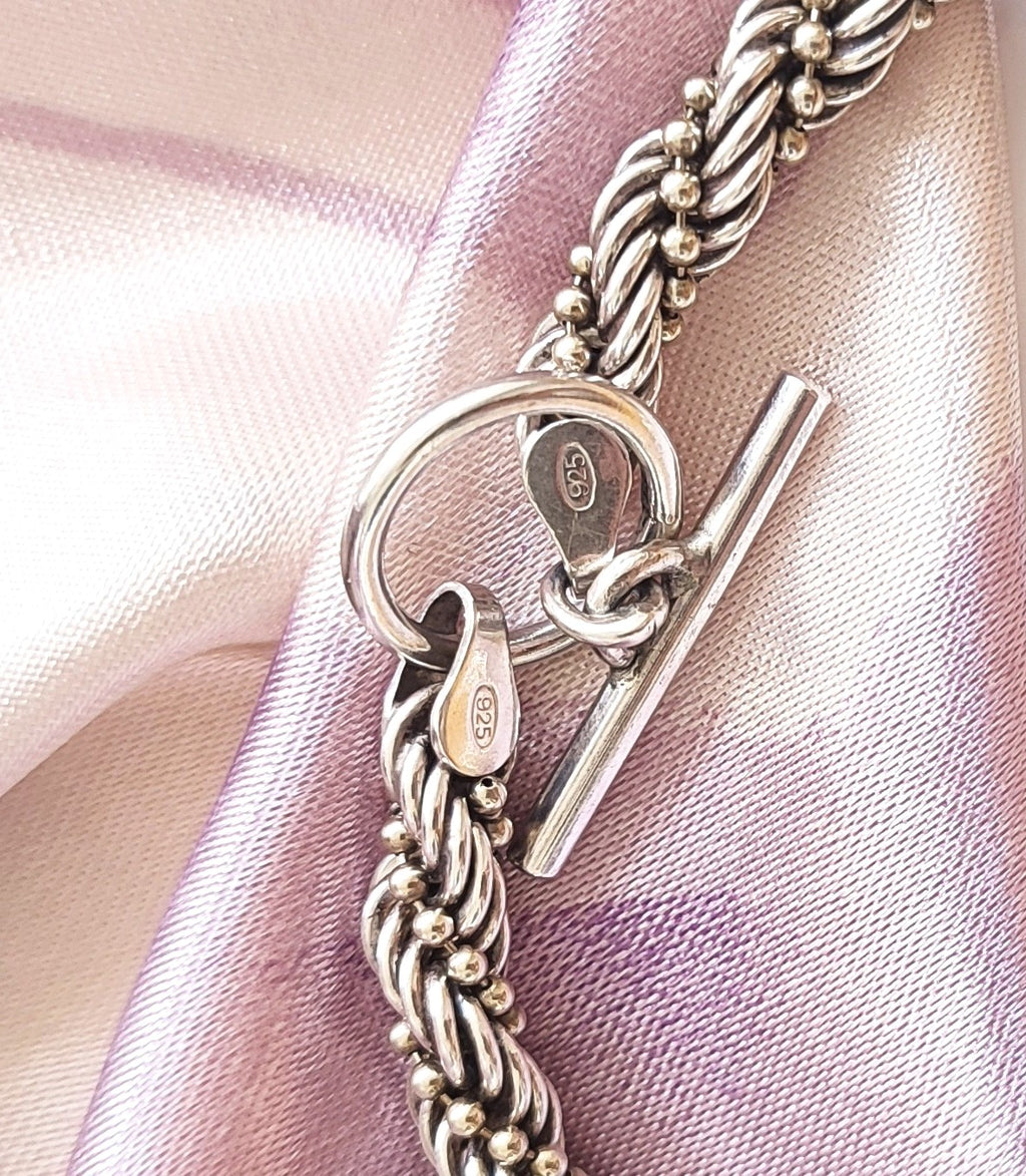 Silver twisted rope bracelet with open clasp
